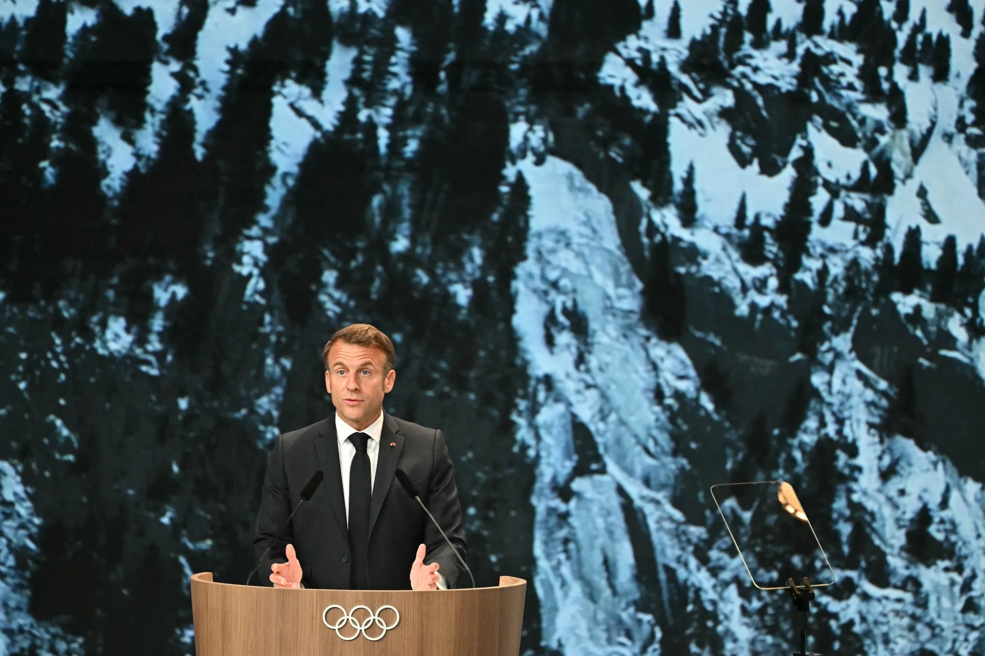 Macron speaks during the French Alps' bid for the 2030 Winter Games during the 142nd session of the International Olympic Committee&nbsp;in Paris on July 24.