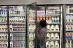 A customer shops for milk at a grocery store in Santa Monica, California.