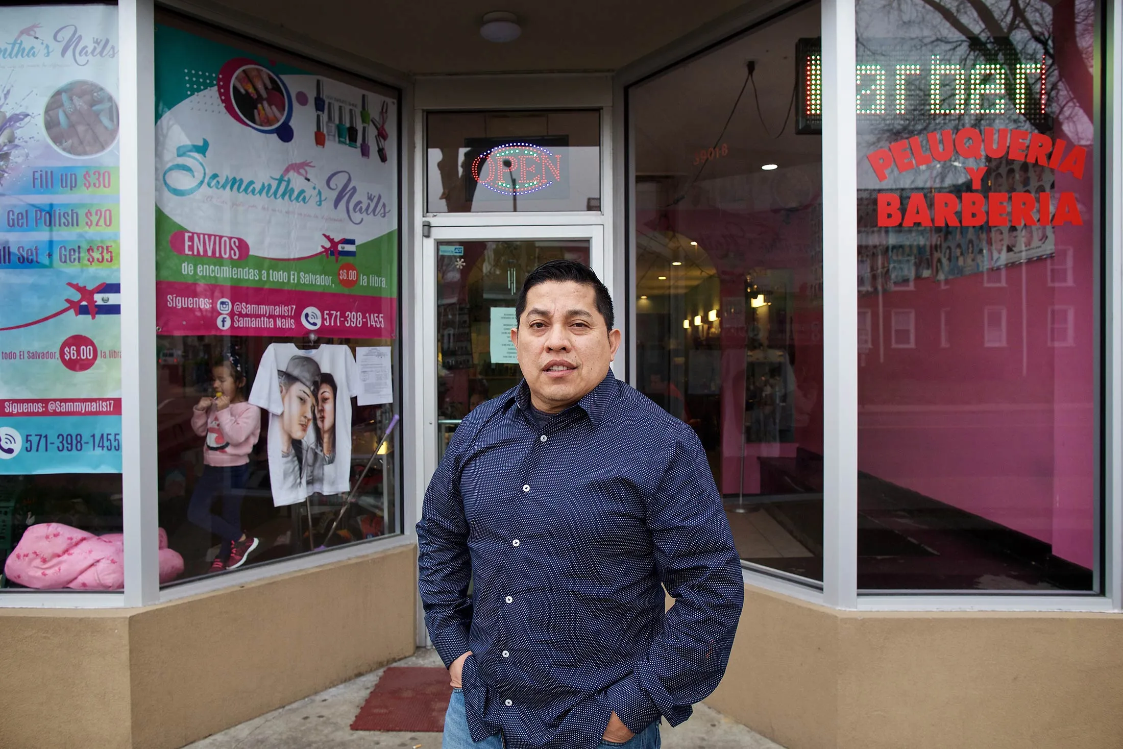 Henver Palma outside his&nbsp;family’s shop in the Arlandria part of Arlington, Va.