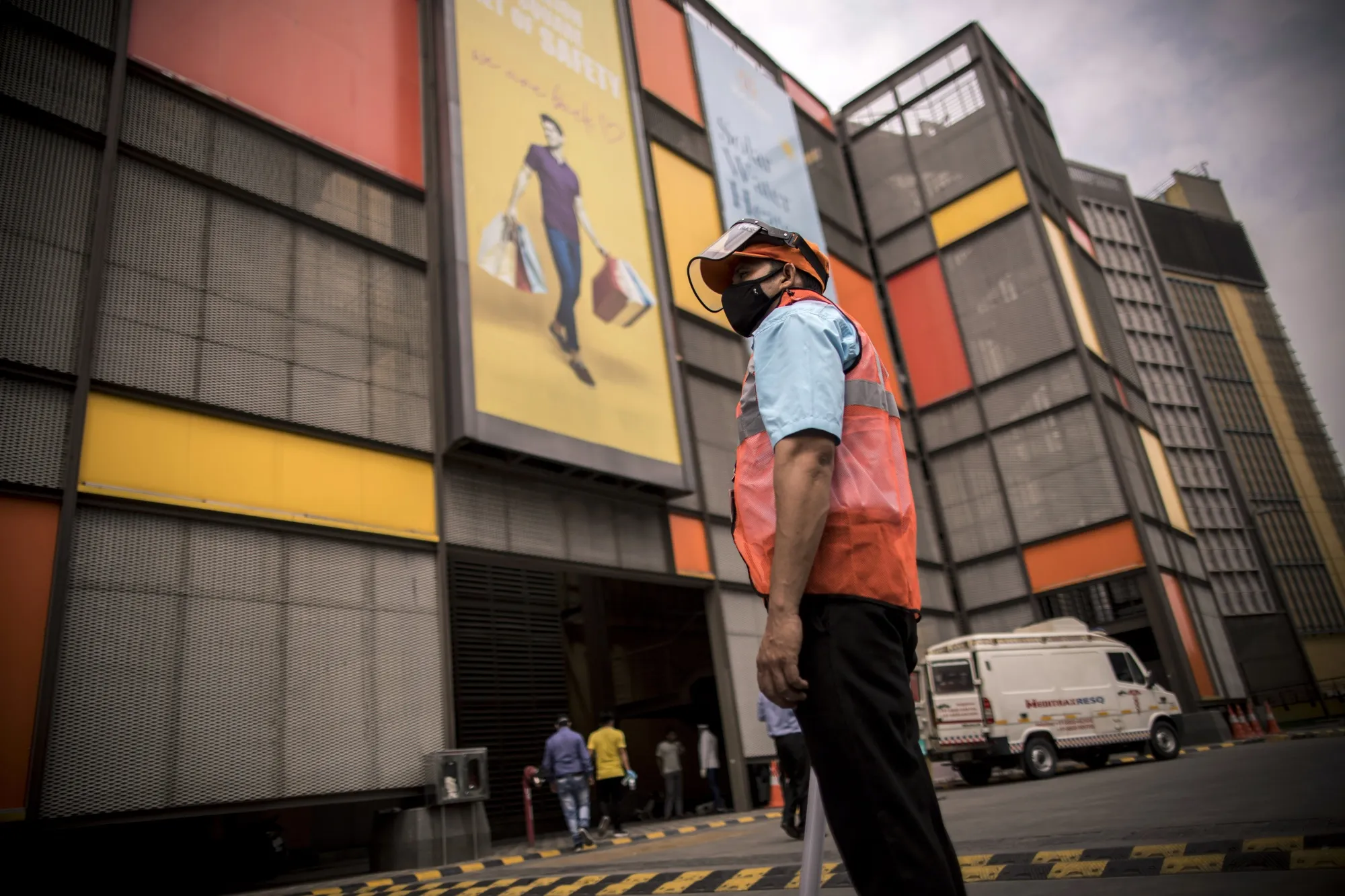 A worker guides people that have received the Covid-19 vaccine to an observation area at a vaccination site&nbsp;at the DLF Mall of India in Noida, Uttar Pradesh, India.