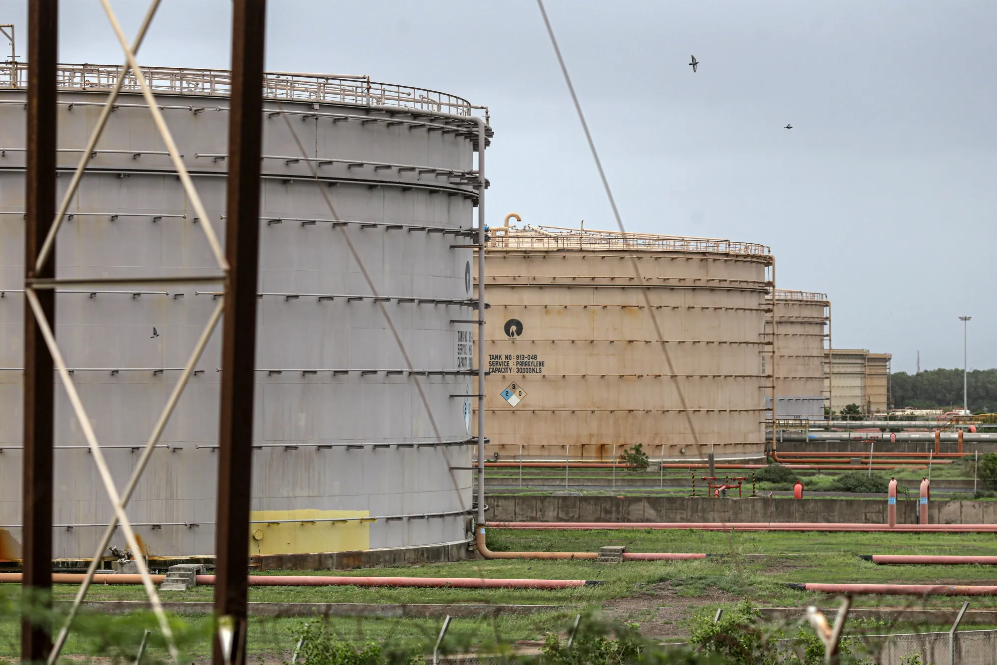 Storage tanks at the Reliance Industries Ltd. oil refinery in Jamnagar, Gujarat, India.