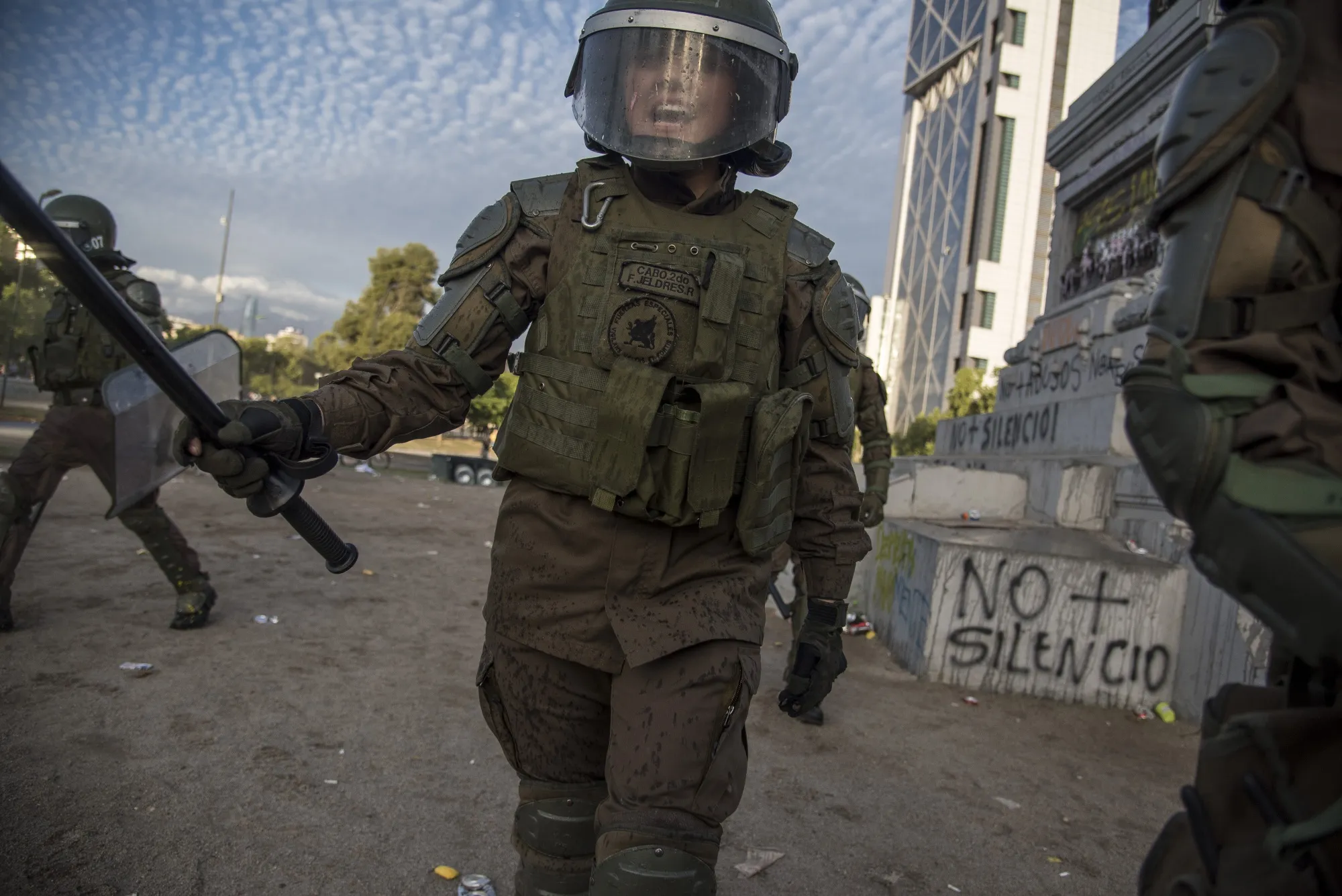 Riot police patrol during a protest at the Plaza Italia in Santiago in 2019.