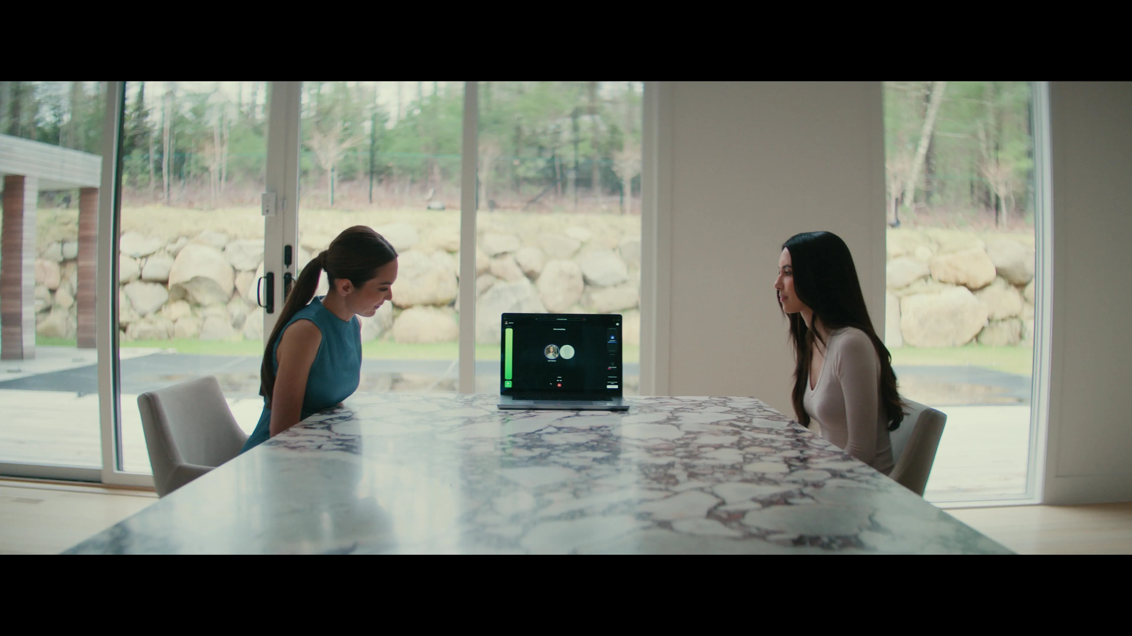 Emily Chang and&nbsp;Caryn Marjorie, right, speak to “CarynAI,” a girlfriend chatbot based on Marjorie’s voice and character.