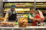 Workers prepare vegetables inside a Sweetgreen Inc. restaurant in Boston.