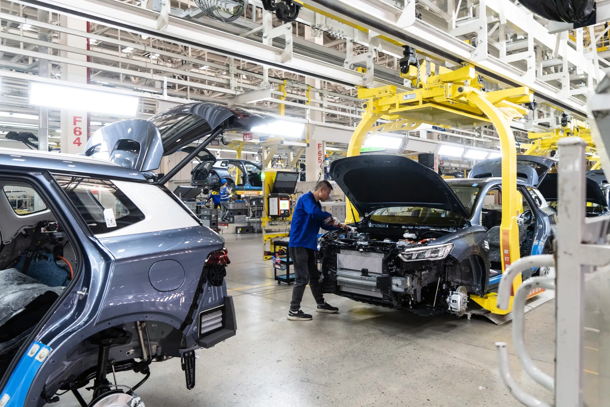 Workers on the assembly line for electric vehicles at the BYD Co. factory in Zhengzhou, Henan province, China, on Nov. 5.
