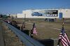 American flags fly in front of the GM plant in Lordstown, Ohio, in March. The automaker has sold the factory to Lordstown Motors.