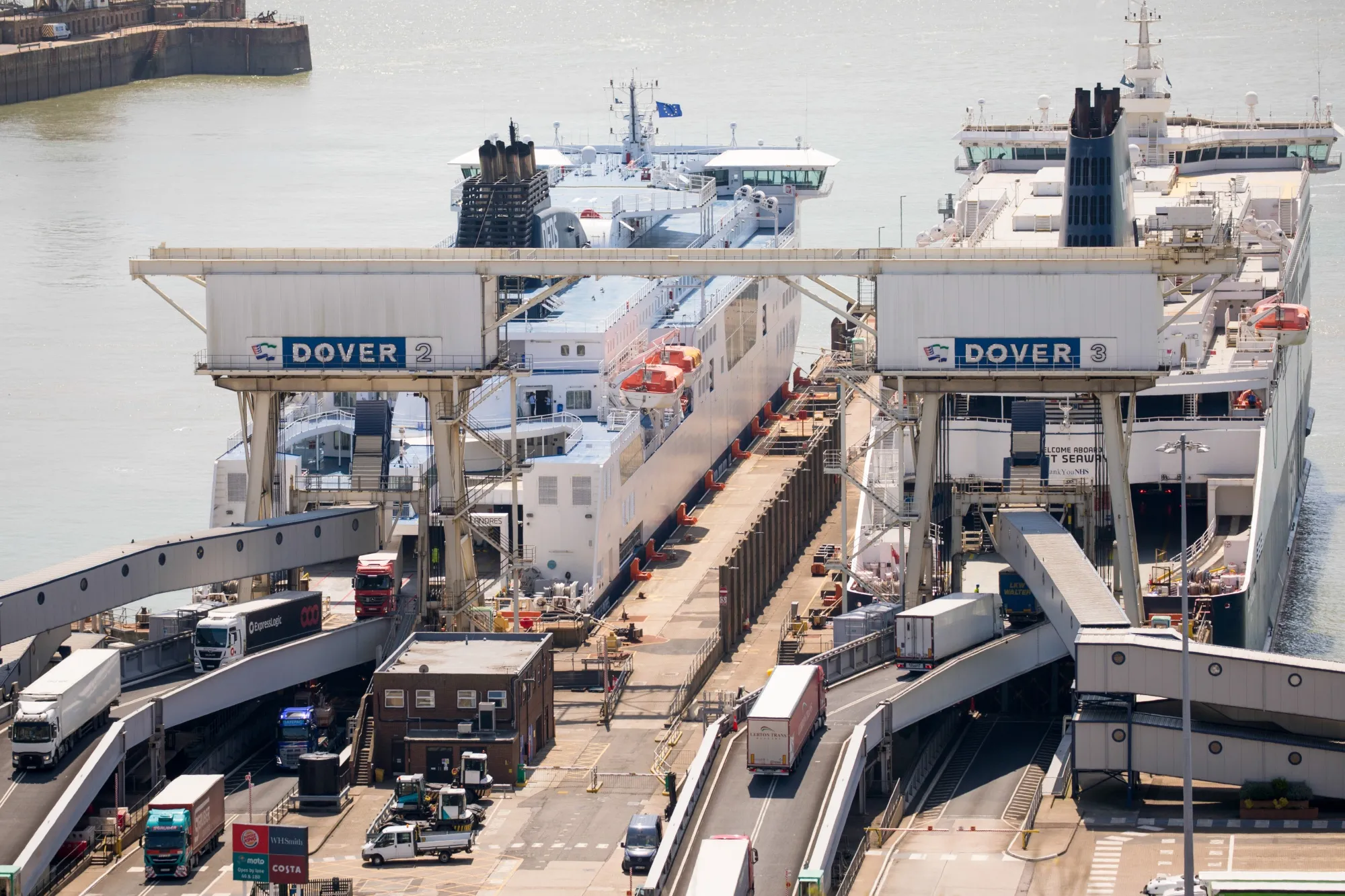 Ferries load and unload trucks at the Port of Dover in the U.K. in May.