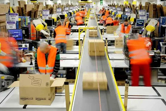 Workers in the shipping department at the Amazon Logistics Center in Pforzheim, Germany, in December 2012