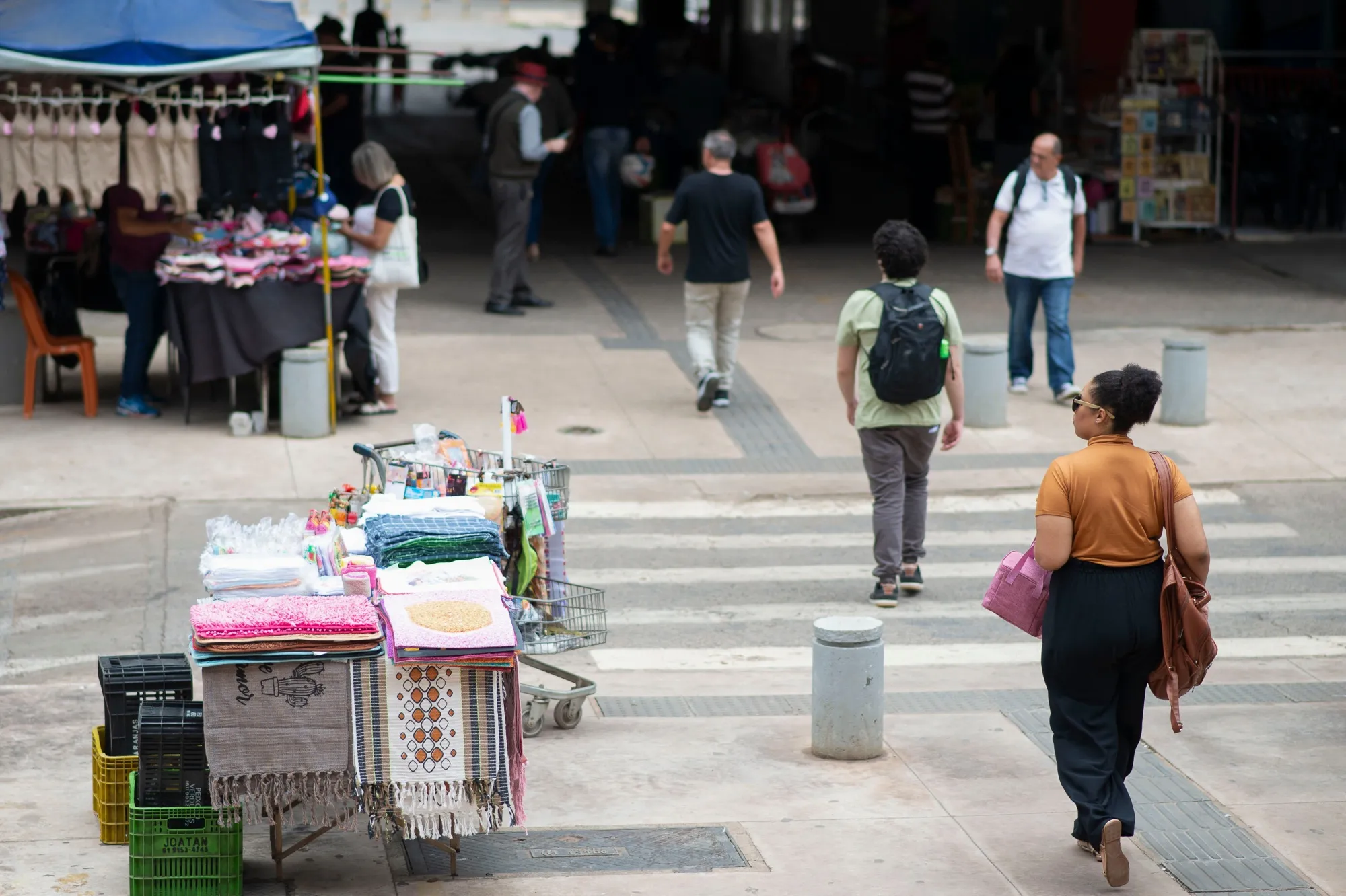 Shoppers walk past street vendors in Brasilia.
