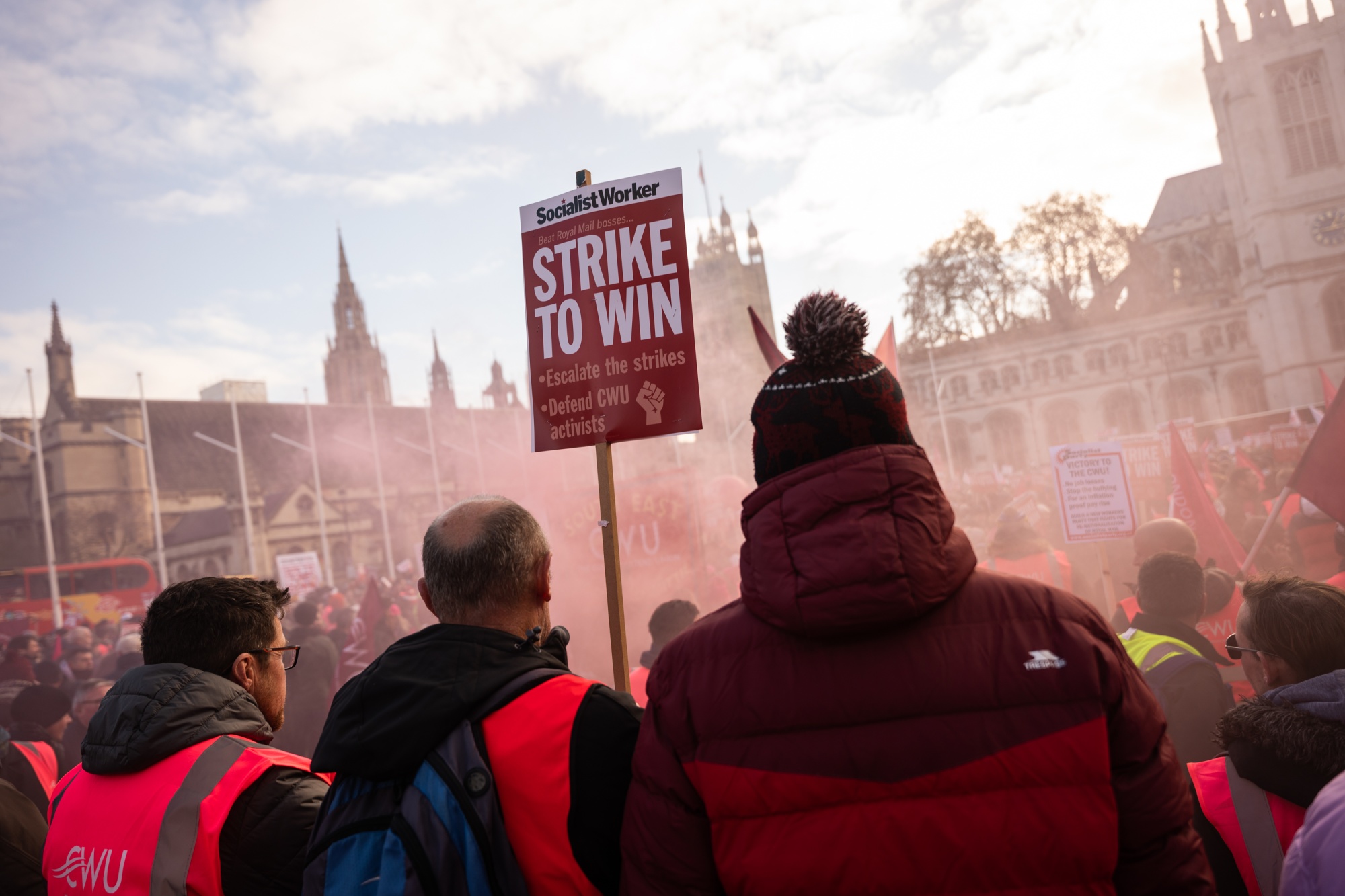 Striking Royal Mail workers attend the 'National Postal Workers Strike Rally' outside the Houses of Parliament in London, on Dec. 9.