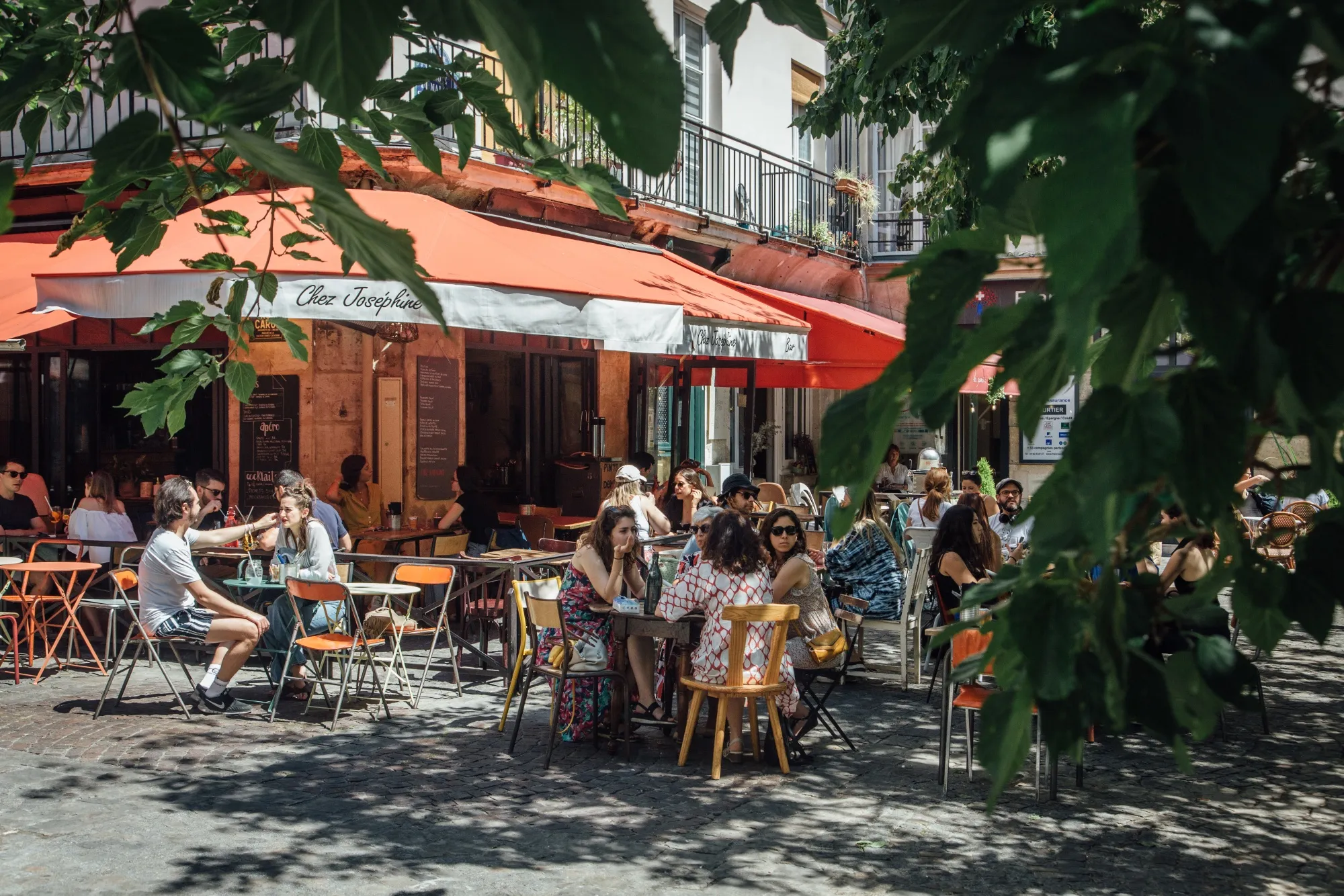 Customers eat and drink on a cafe terrace as France reopens cafes, restaurants and public spaces, in Paris, on June 2.