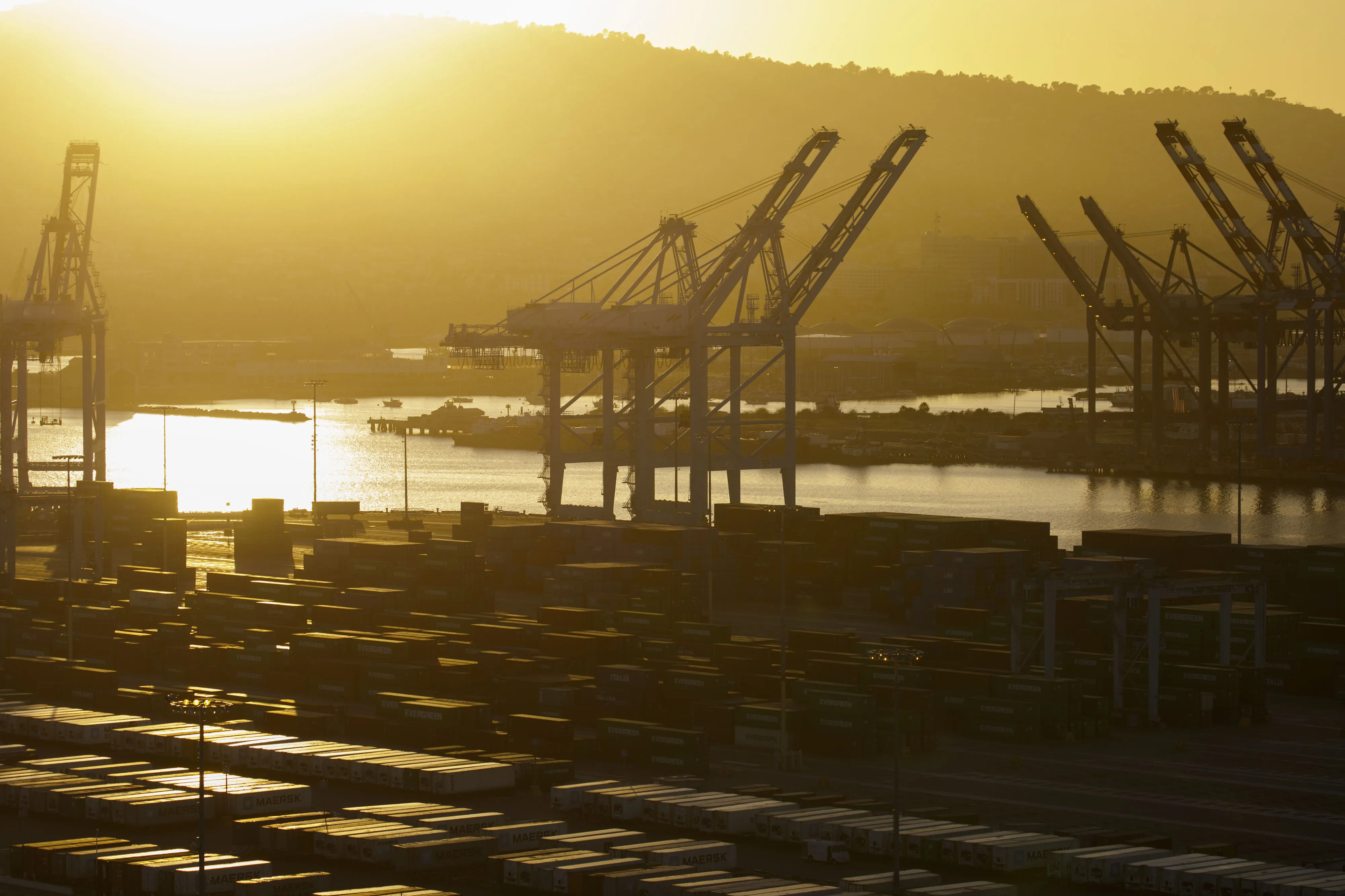 Gantry cranes stand above the APM shipping terminal in the Port of Los Angeles in this aerial photograph taken above Los Angeles.