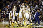 Missouri players celebrate at the end of an NCAA college basketball game against South Carolina on Thursday, Dec. 30, 2021 in Columbia, Mo. The Tigers defeated the Gamecocks in overtime 70-69. (AP Photo/Colin E. Braley)