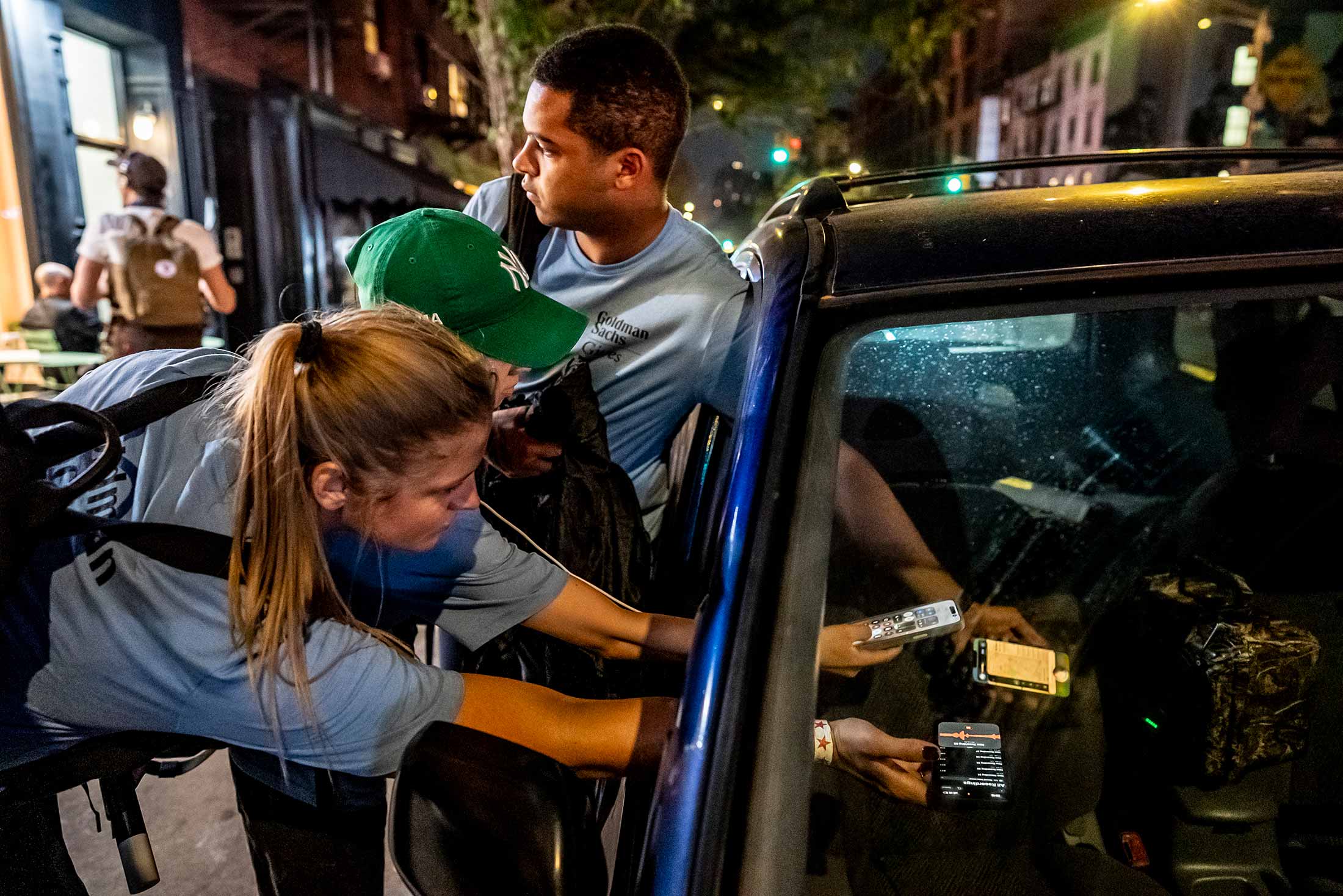 Contestants from Goldman Sachs work to identify a song playing on the radio.