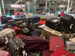 Suitcases uncollected at Heathrow's Terminal Three baggage reclaim.