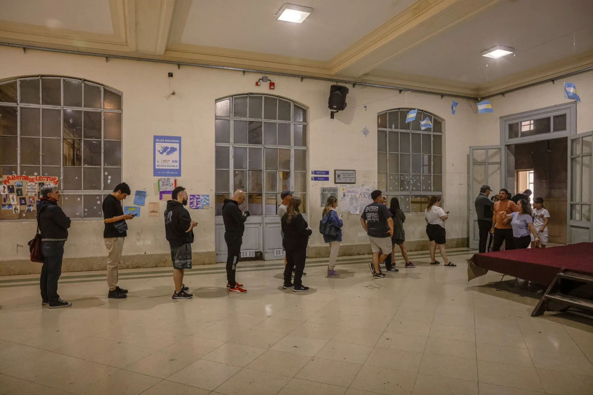 Voters wait in line to cast ballots at a polling station during the midterm elections in La Plata, Buenos Aires province, Argentina, on Oct. 26.