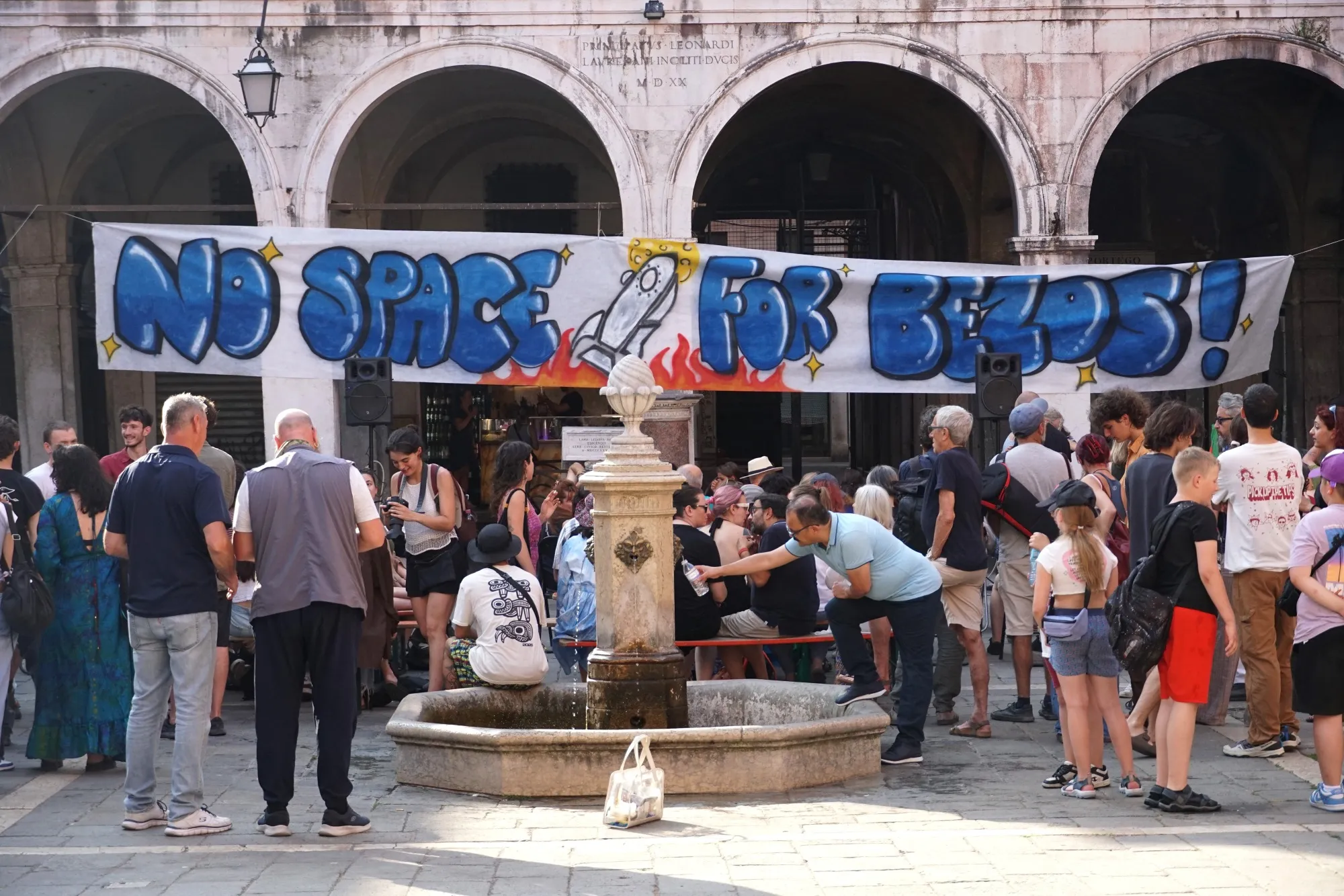 Activists from &quot;No Space For Bezos&quot; gather in Campo San Giacomo&nbsp;square in Venice on&nbsp;June 13.
