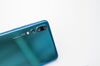 Three Leica Camera AG lenses sit on a P20 Pro smartphone, manufactured by Huawei Technologies Co., during its unveiling in Paris, France, on Tuesday, March 21, 2018. Huawei Technologies Co. is launching the P20 as an upgrade to the higher end of its flagship smartphones, walking in the footsteps of rival Samsung Electronics Co. by betting heavily on the camera.