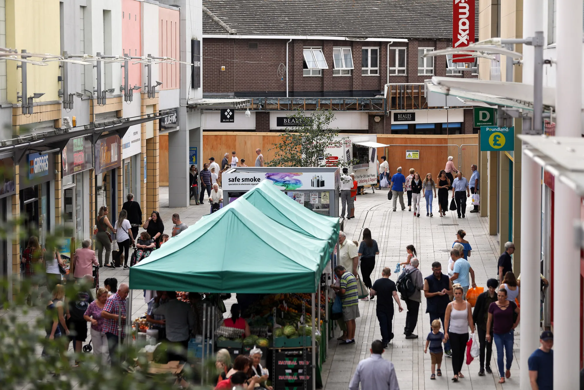 Shoppers pass along the pedestrianized Vancouver Quarter open-air mall in King’s Lynn&nbsp;on Aug. 29, 2017.
