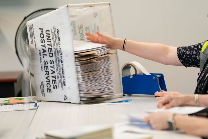 Mail-in ballots are prepared at the Wake County Board of Elections in Raleigh, North Carolina, US on Sept. 11.