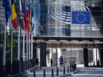 The stars of the European Union (EU) sit on office windows at European Parliament's Paul-Henri Spaak building in Brussels, Belgium, on Wednesday, May 27, 2020.
