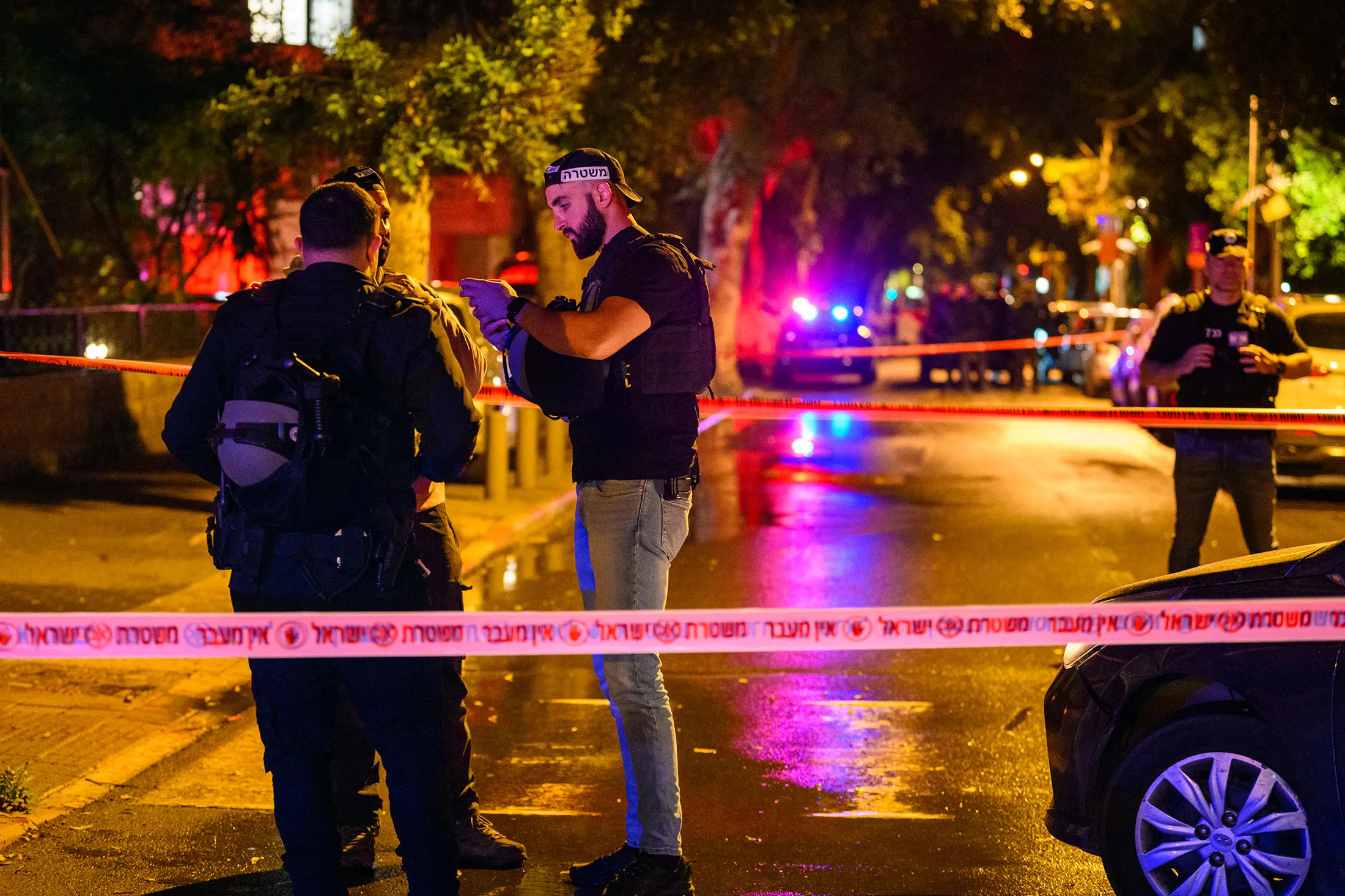 First responders at the site of an Iranian missile attack in Tel Aviv on April 2.
