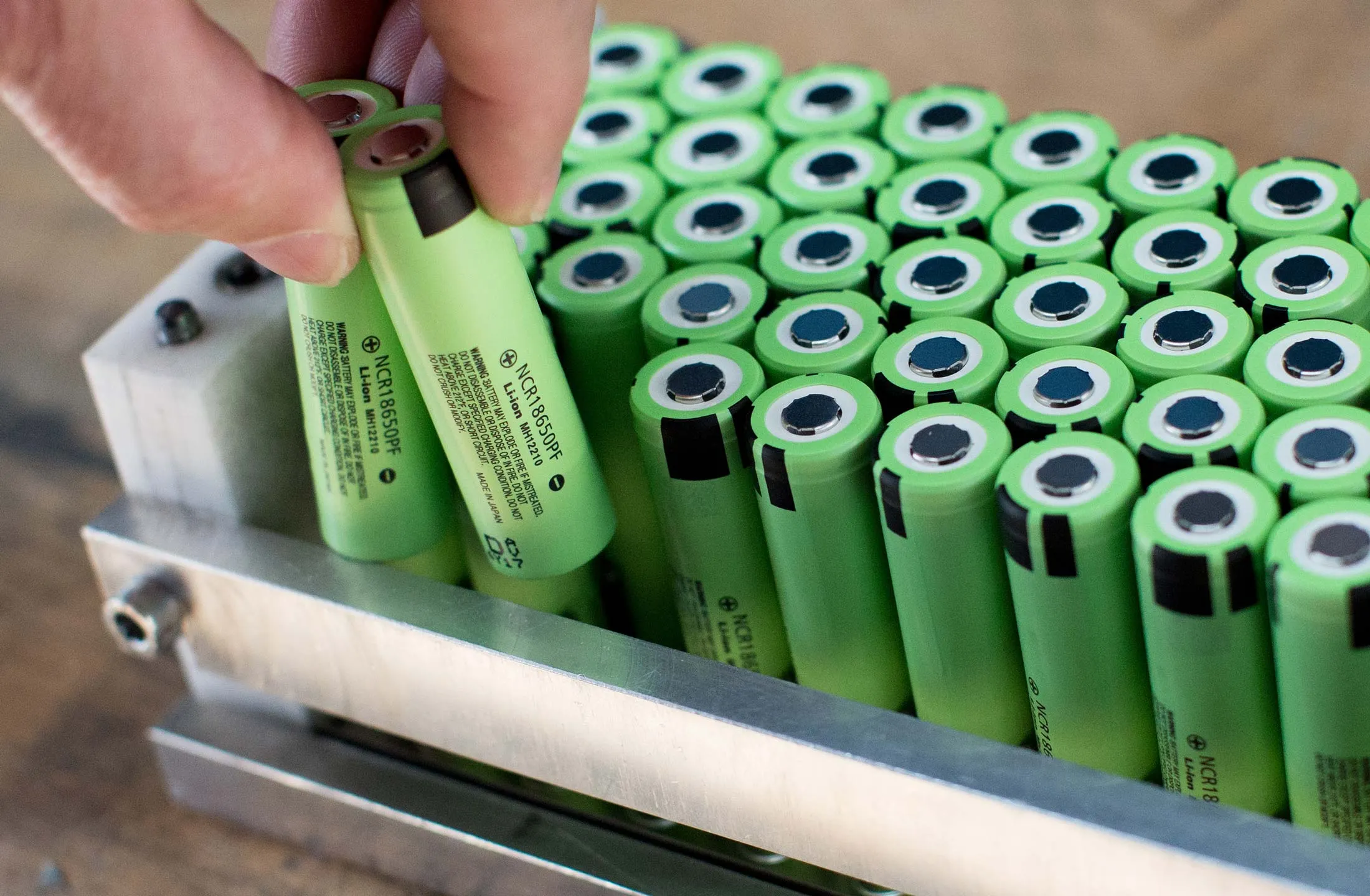 An employee inserts lithium-ion battery cells during battery pack assembly at the Johammer factory in Bad Leonfelden, Austria.
