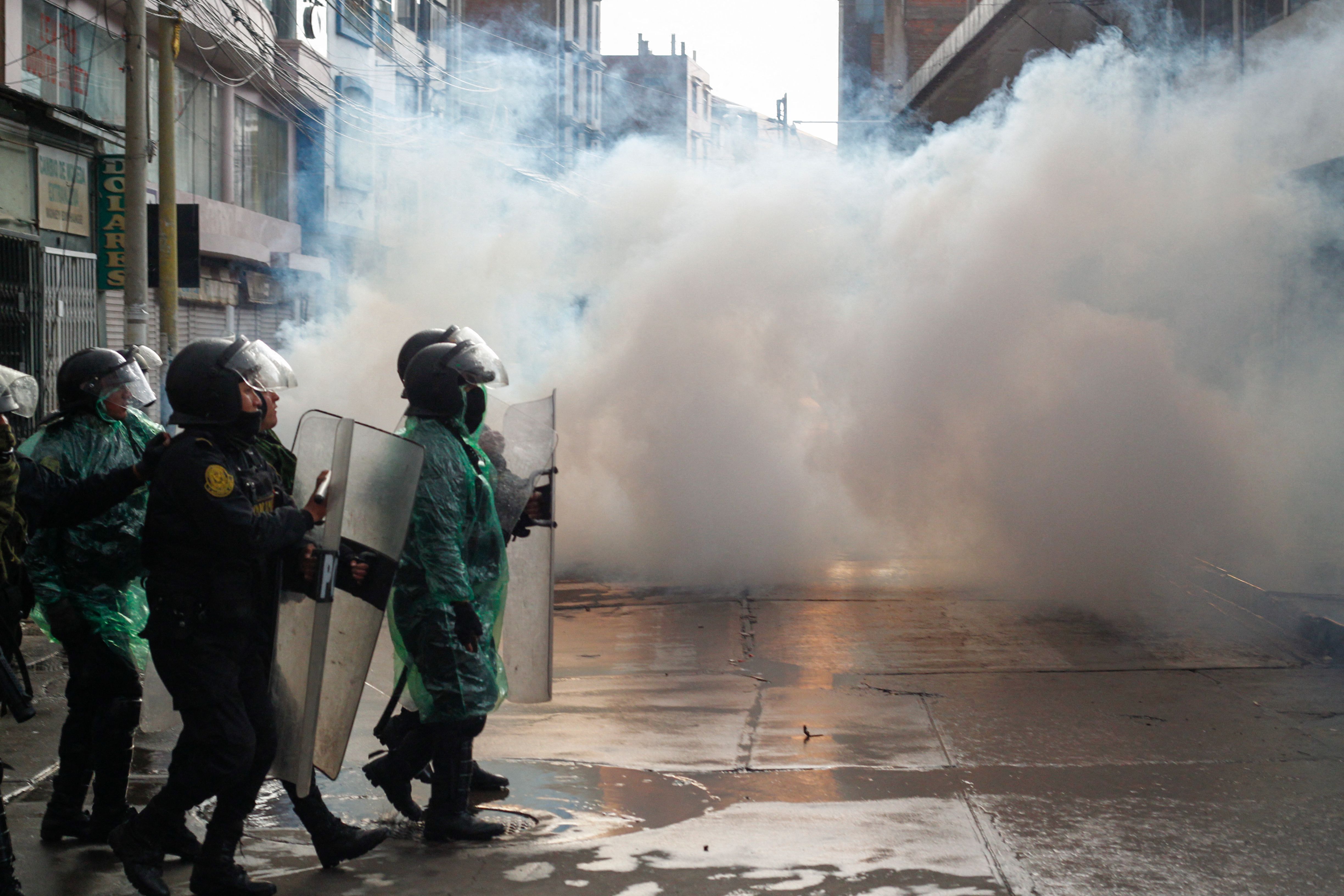 Riot police clash with anti-government protesters in Peru, on Jan. 9.