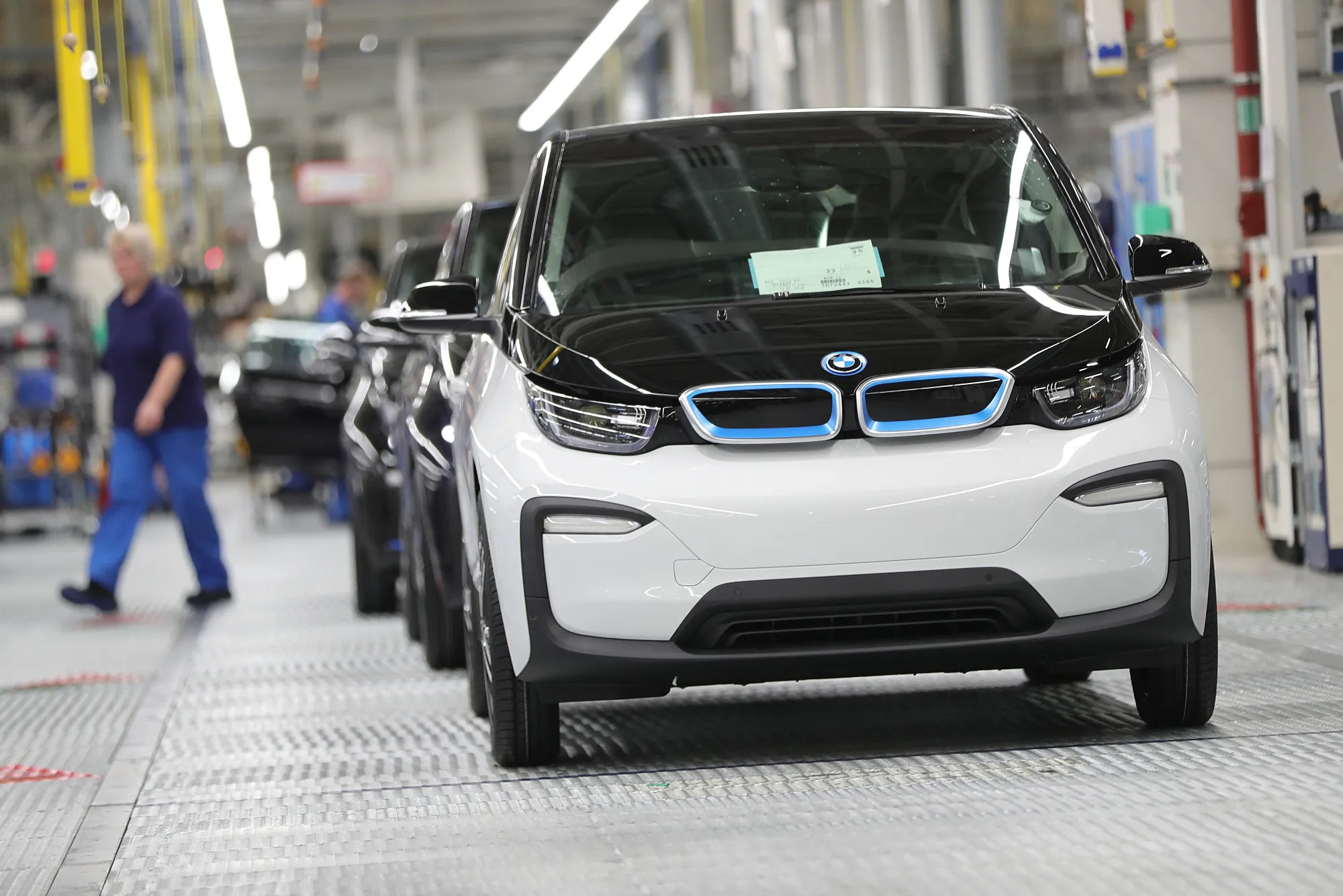 Newly assembled BMW i3 electric automobiles sit on the final quality control line at the Bayerische Motoren Werke AG factory in Leipzig, Germany, on Thursday, March 14, 2019.&nbsp;