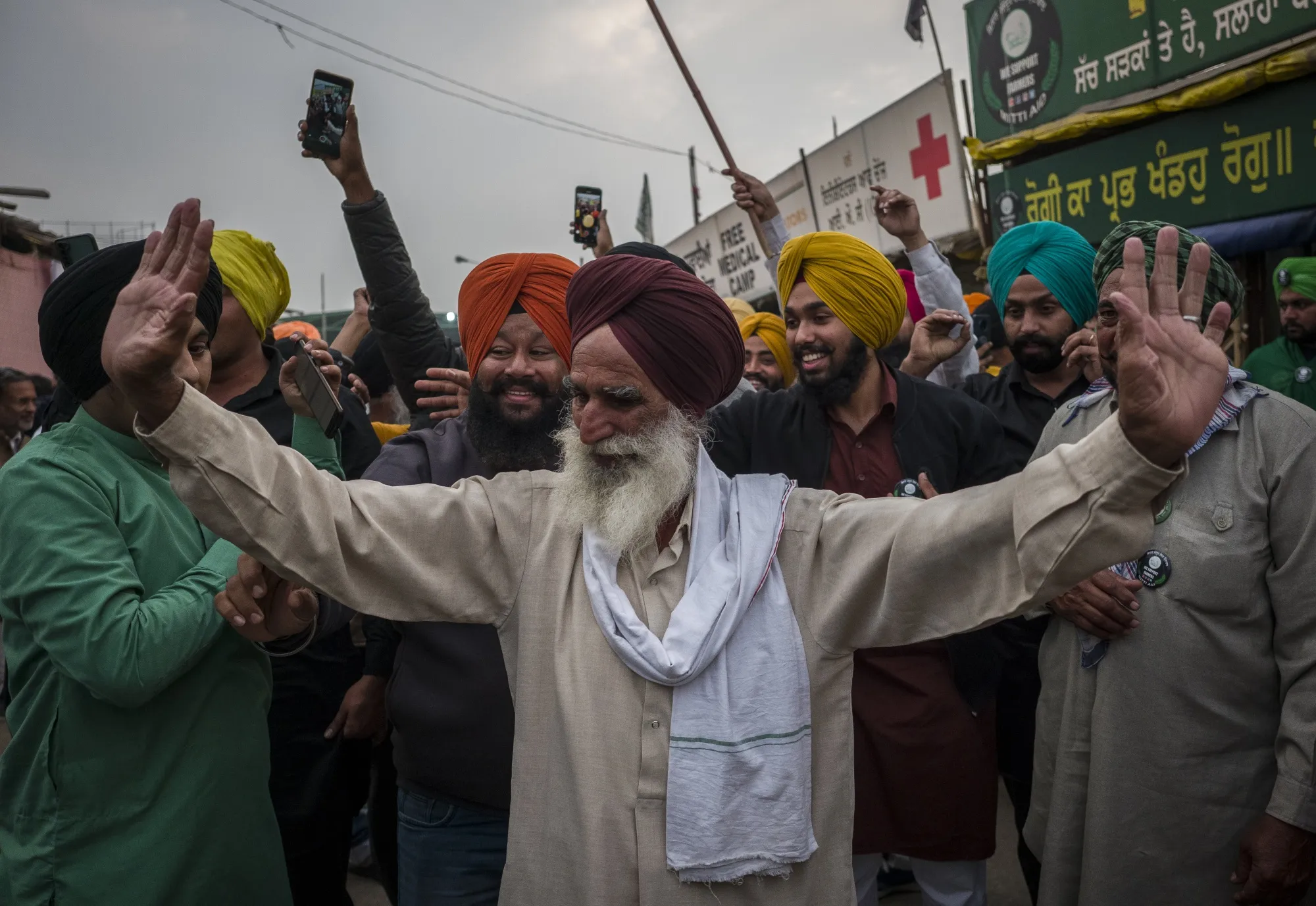 Farmers celebrate after Modi withdrew a controversial agriculture bill.