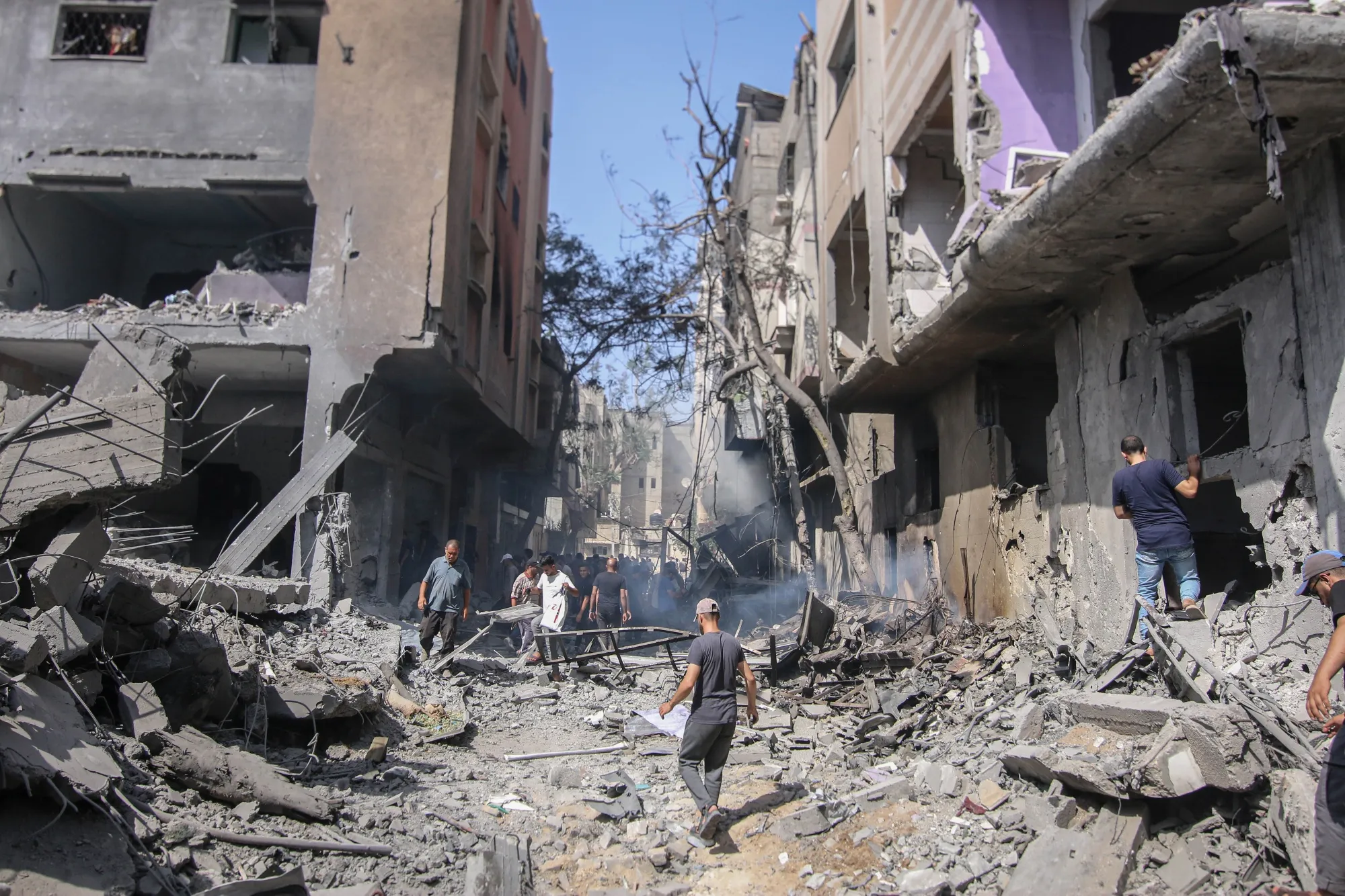 Palestinians at the site of an Israeli strike at the Nuseirat refugee camp in central Gaza.