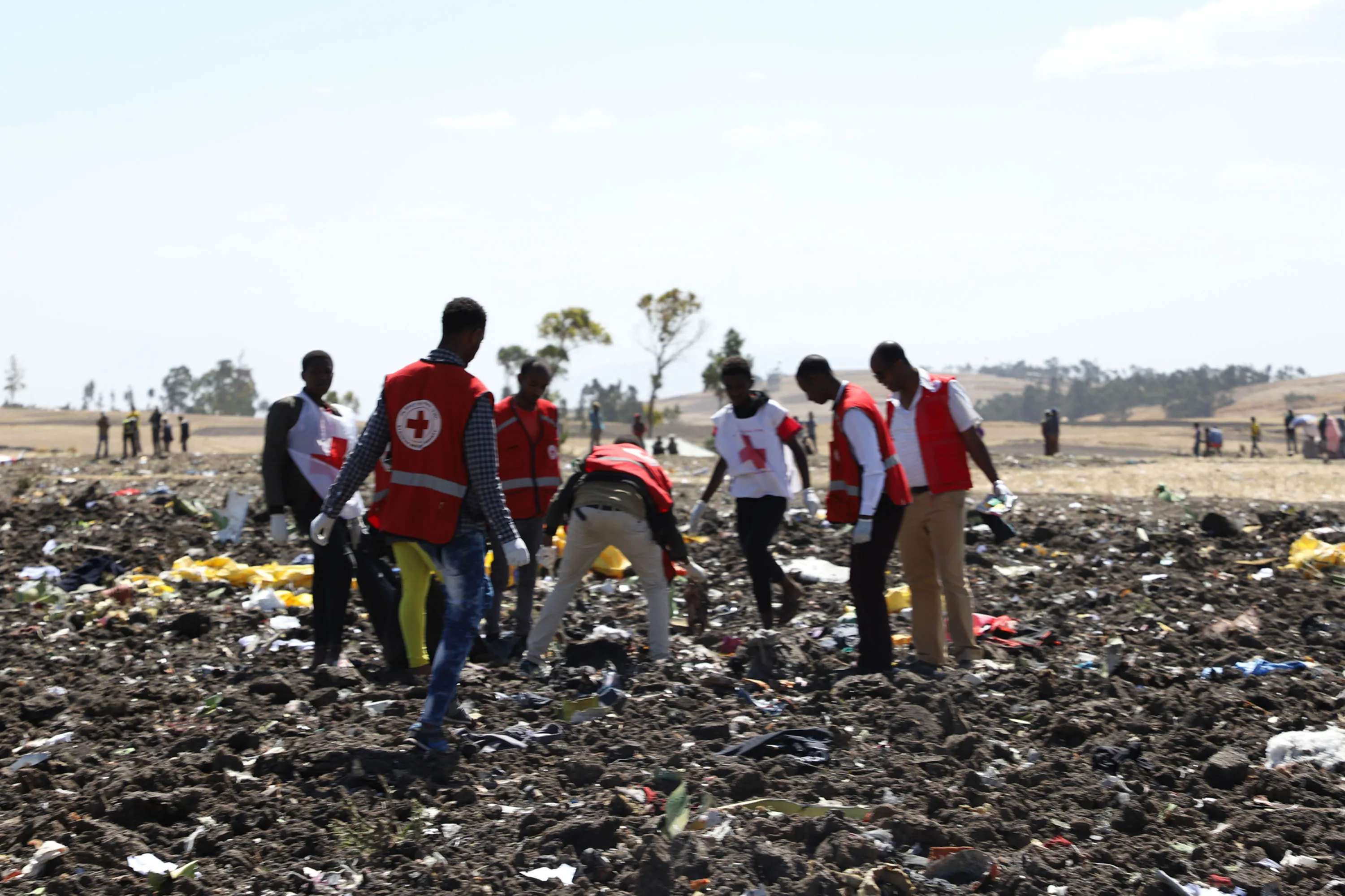 Red cross teams work amid debris at the crash site of Ethiopia Airlines near Bishoftu.