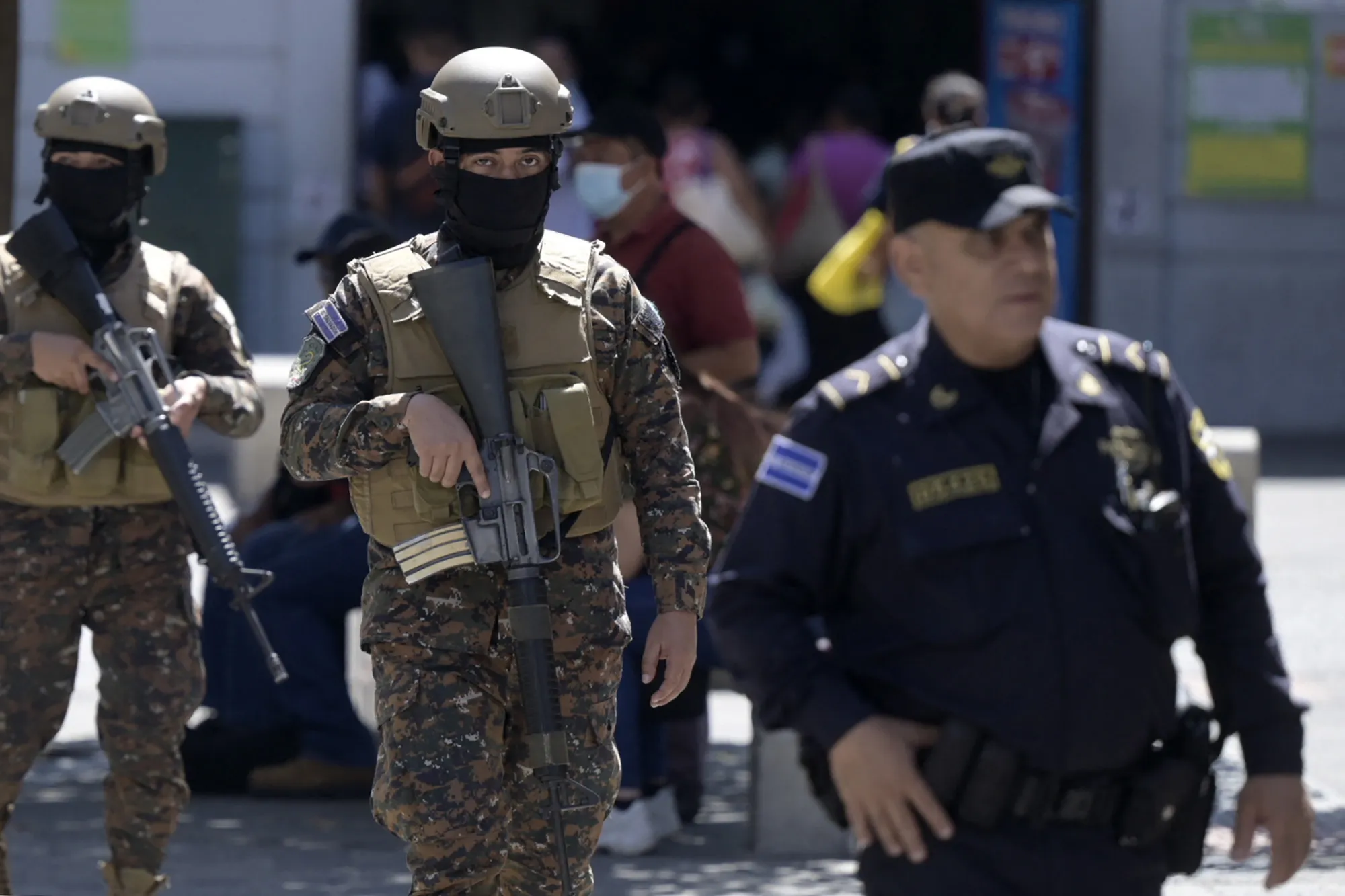 Soldiers patrol the streets following the government's declaration of state of emergency, in San Salvador, on March 27.&nbsp;