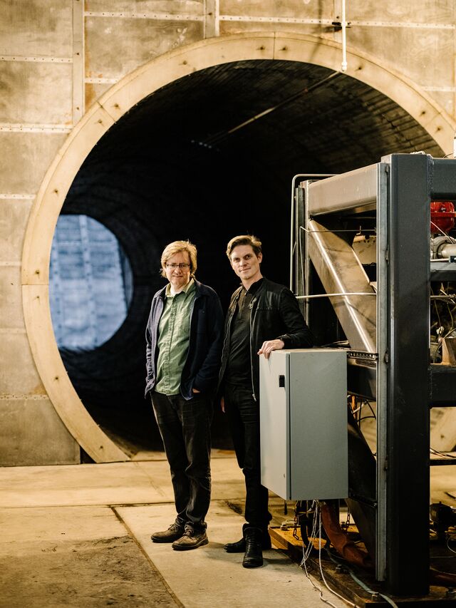 Adam London (left) and Chris Kemp (right), the cofounders of Astra, inside a rocket engine test chamber