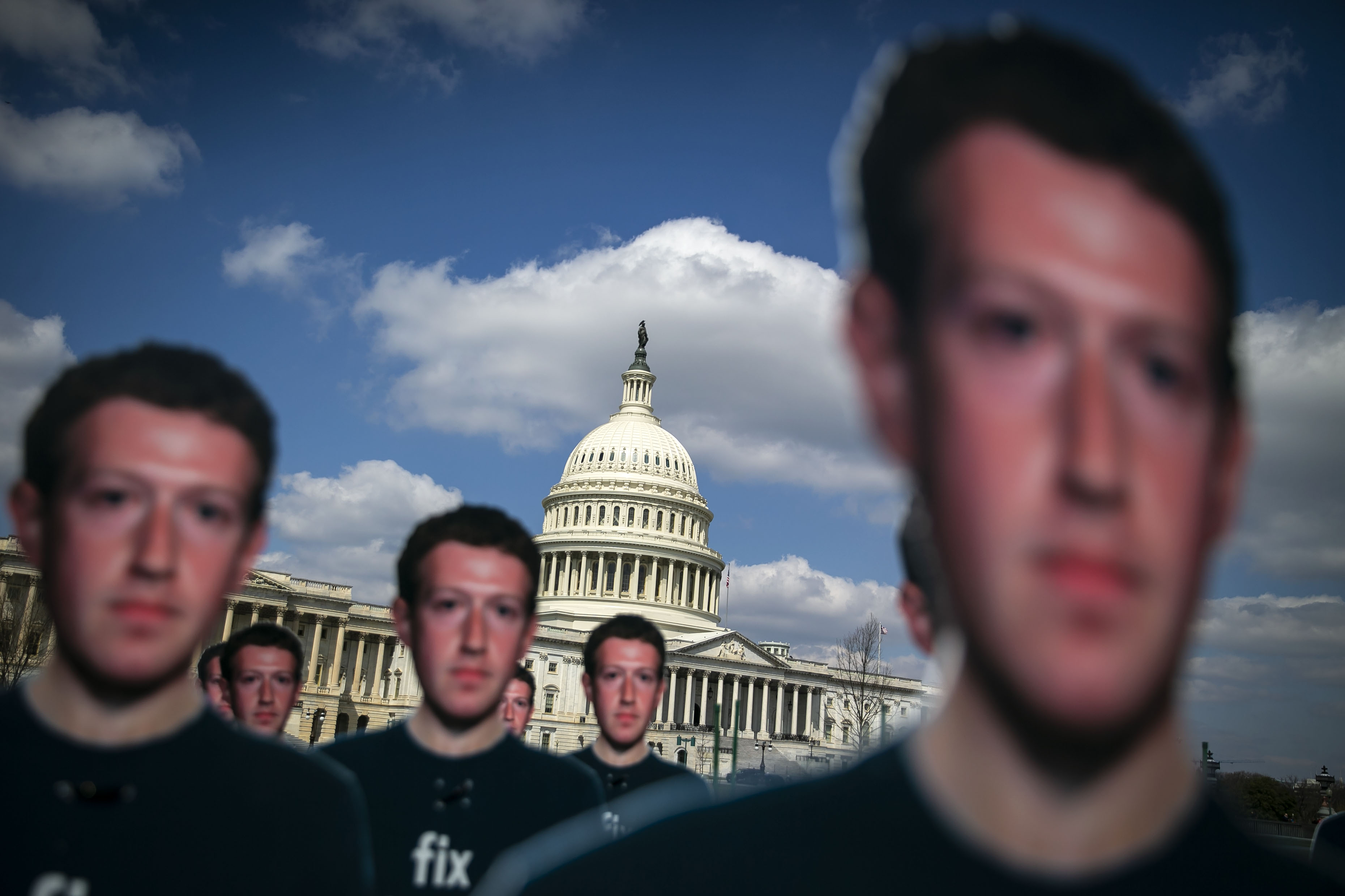 Cutouts of Facebook CEO Mark Zuckerberg are displayed on the South East lawn of the Capitol building ahead of testimony before a joint hearing of the Senate Judiciary and Commerce Committees in Washington, D.C., U.S., on Tuesday, April 10, 2018.&nbsp;