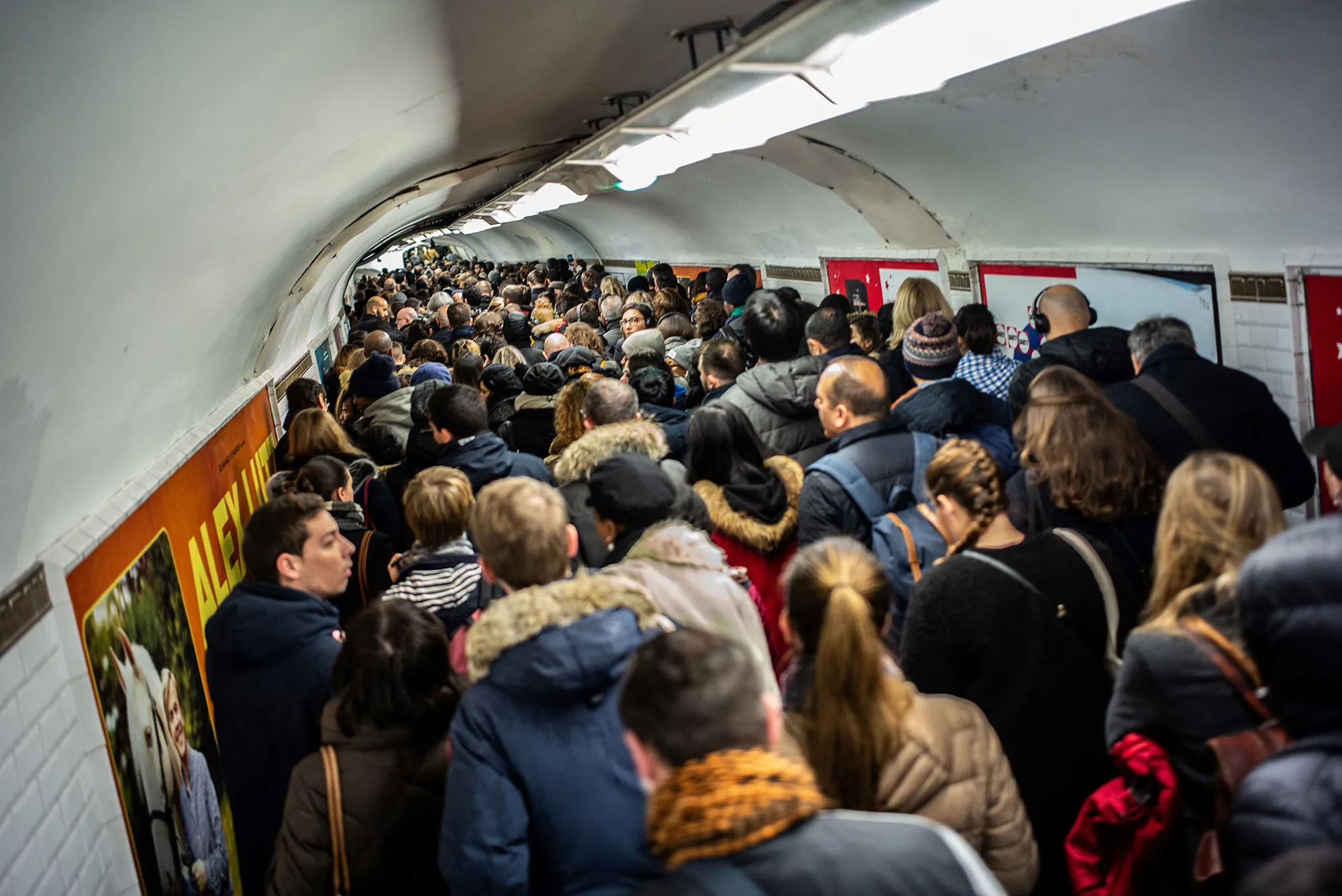 Commuters walk in a subway station corridor in Paris during a strike on Dec. 16.