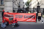 Greenpeace activists stage a sit-in outside Downing Street to protest against the Cambo oil field project, in London in 2021.