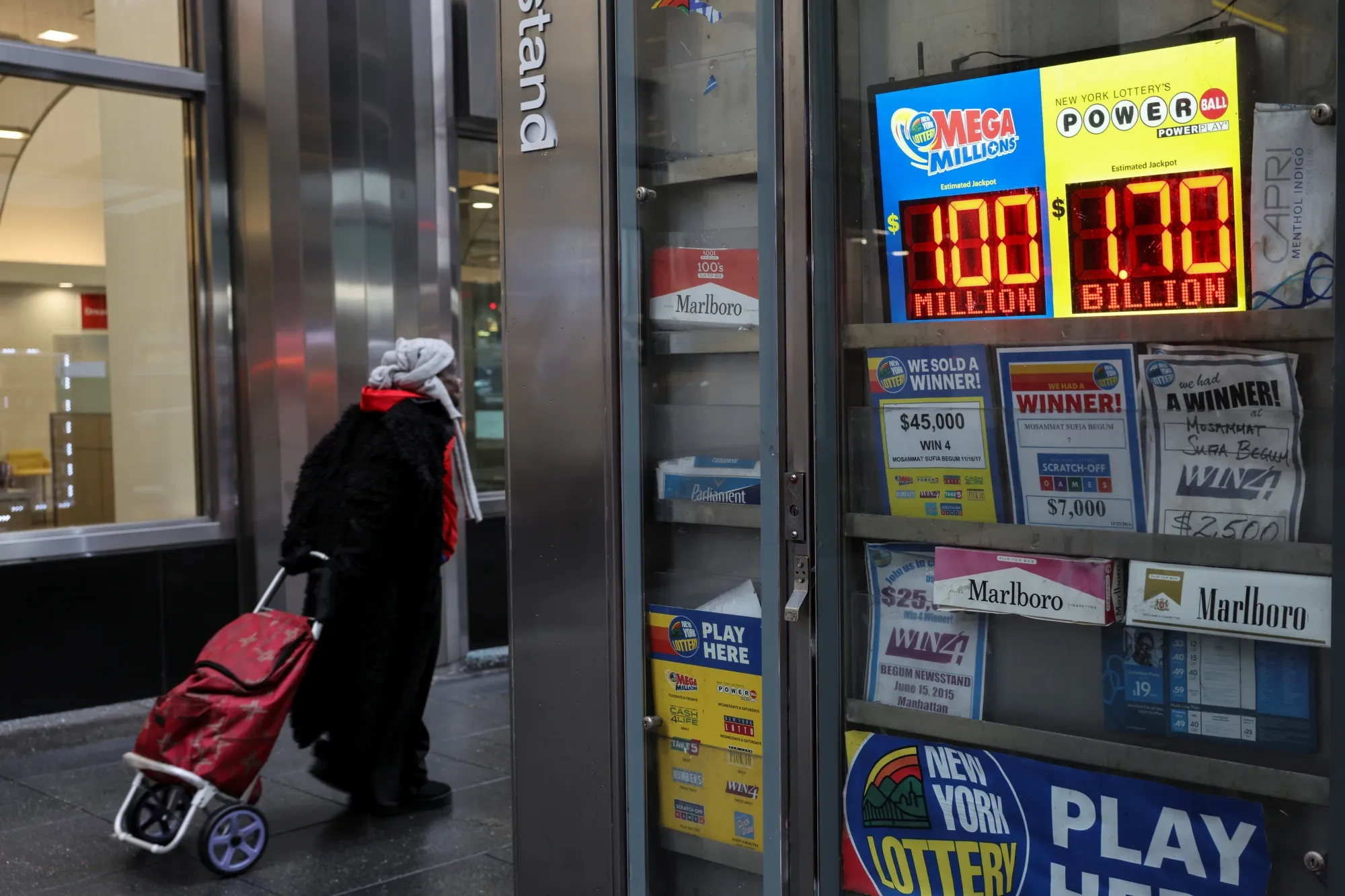 Powerball and Mega Millions' jackpot numbers displayed at a news standon in New York on Dec. 23.