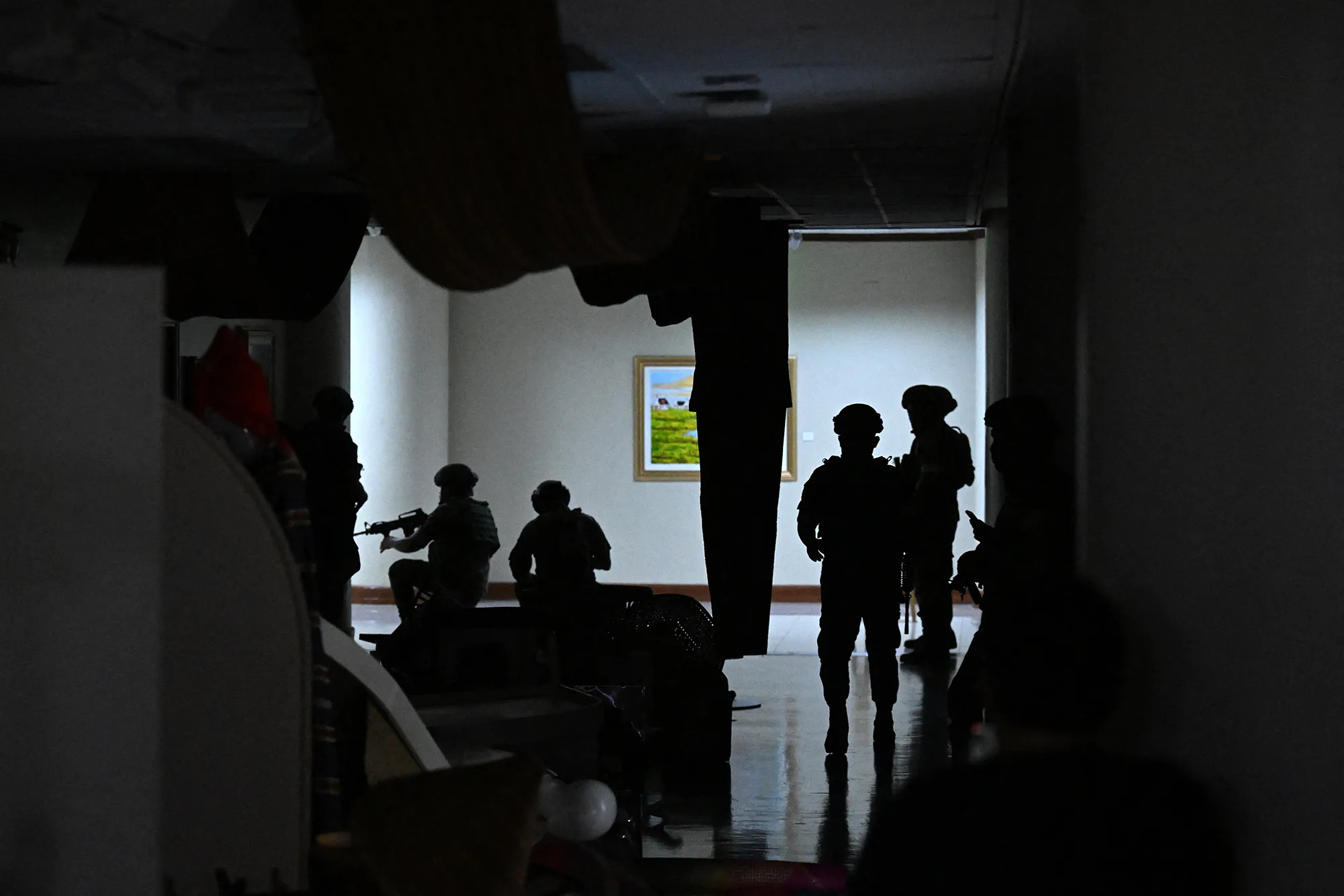 Philippine troops exchange gunshots inside the Senate of the Philippines in Pasay, Metro Manila on May 13.