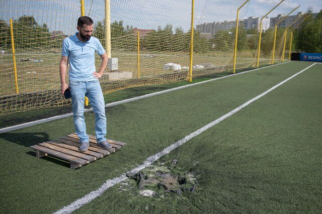 Founder and owner of the company Сollar Yuriy Sinitsa shows places in the stadium where rockets fell in Chernihiv, Ukraine, on Monday, July 4, 2022. Photographer: Andrew Kravchenko