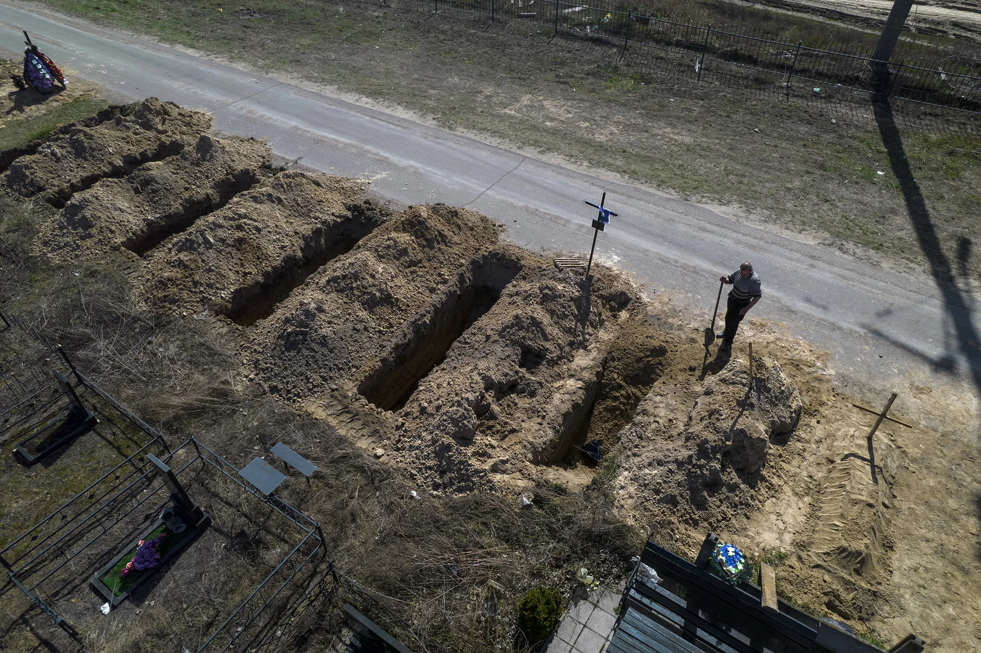 A cemetery worker in Bucha near Kyiv, on April 14.