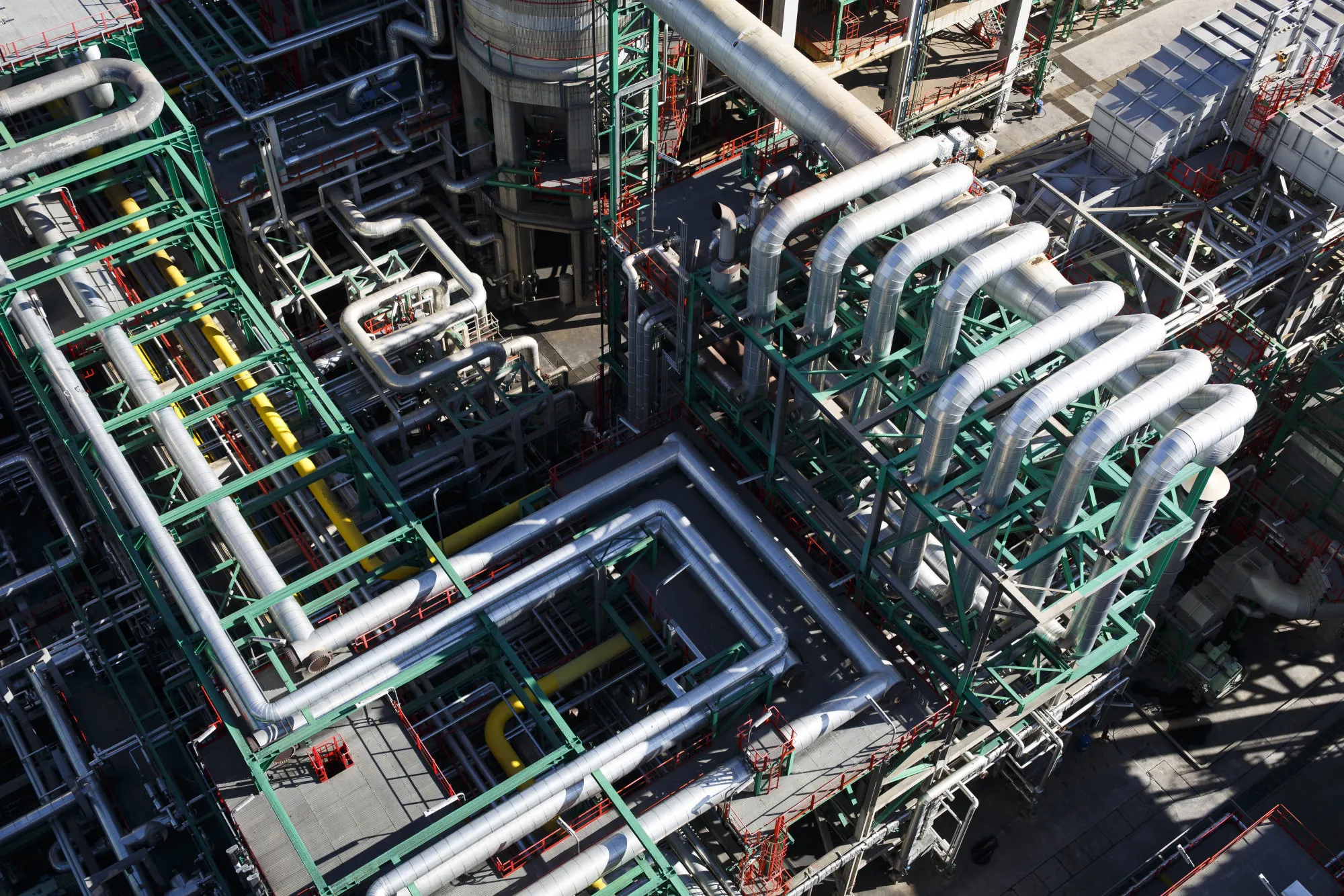 Pipework used for processing oil sit at the Repsol SA refinery in Cartagena, Spain, on Tuesday, Nov. 24, 2015. Since the oil-market slump started in mid-2014, the lower cost of crude has boosted profits for refiners and helped companies including Repsol to buoy earnings.