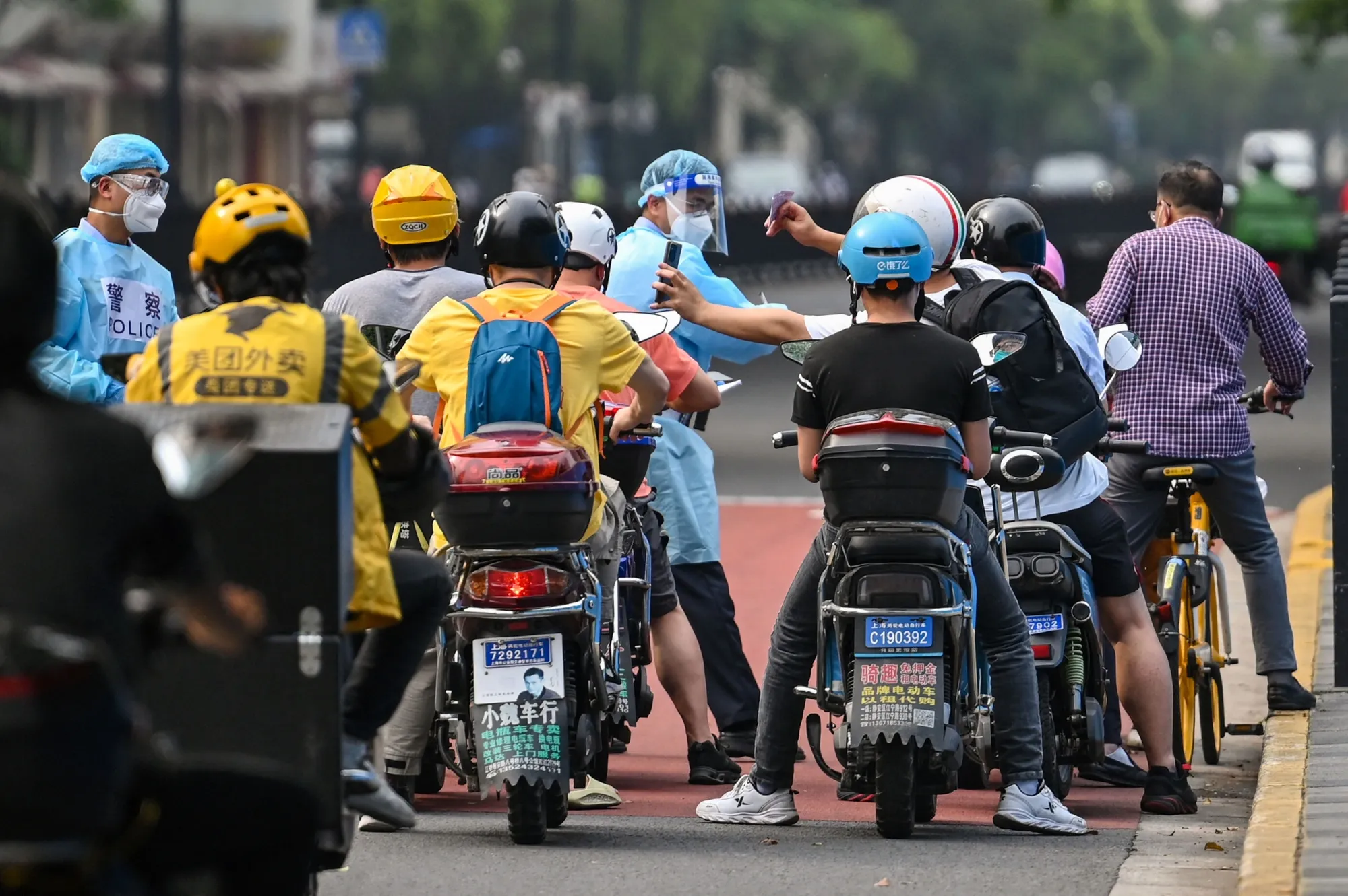 Police check motorists&nbsp;during a Covid-19&nbsp;lockdown in&nbsp;Shanghai on May 27.
