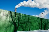 Green Fence And Chimney Vapor