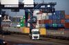 A haulage truck passes shipping containers at the Port of Felixstowe Ltd., a subsidiary of CK Hutchison Holdings Ltd., in Felixstowe, U.K., on Monday, Jan. 25, 2021. Elevated container rates “may factor in for the rest of the year,” even if the current disruptions get ironed out, said Chris Rogers, lead trade analyst for S&P Global Market Intelligence’s Panjiva.