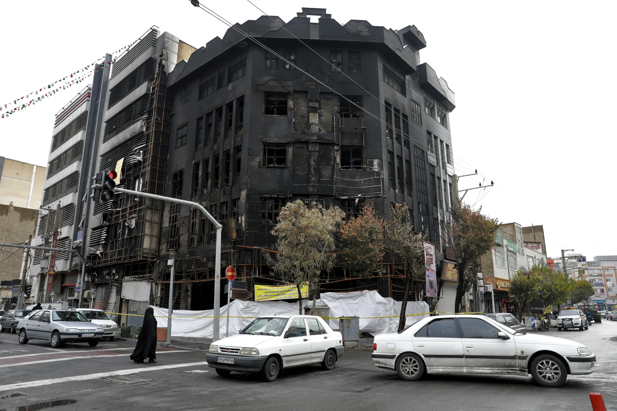 A building set ablaze during protests in Tehran in&nbsp;November 2019.