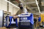 An employee prepares grocery delivery bags from&nbsp;Fridge No More in&nbsp;Brooklyn.