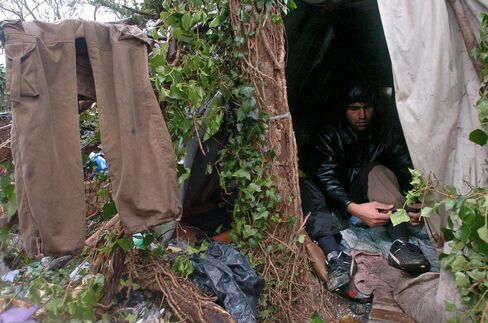 An illegal immigrant is seen at a camp called "the jungle" in Calais, France, Wednesday, January 10, 2007