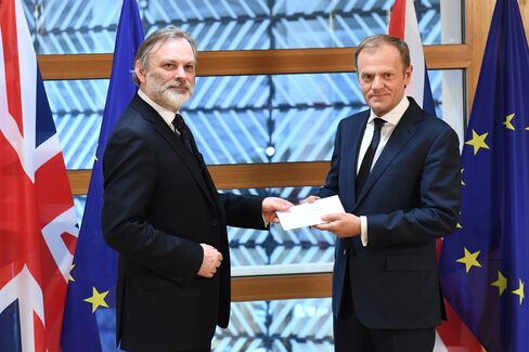 U.K. ambassador to the EU Tim Barrow delivers Theresa May’s letter to Donald Tusk in Brussels, March 29.