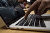 An attendee demonstrates the Touch Bar on a new MacBook Pro laptop computer during an event at Apple Inc. headquarters in Cupertino, California, U.S., on Thursday, Oct. 27, 2016. Apple Inc. introduced the first overhaul of its MacBook Pro laptop in more than four years, demonstrating dedication to a product that represents a small percentage of revenue.